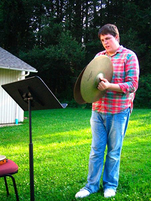 Nathan von Trotha practicing the cymbals outside at BUTI