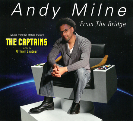 Cover of Andy Milne's CD From The Bridge featuring a photo of Milne sitting on the captain's chair of the Enterprise from Star Trek.