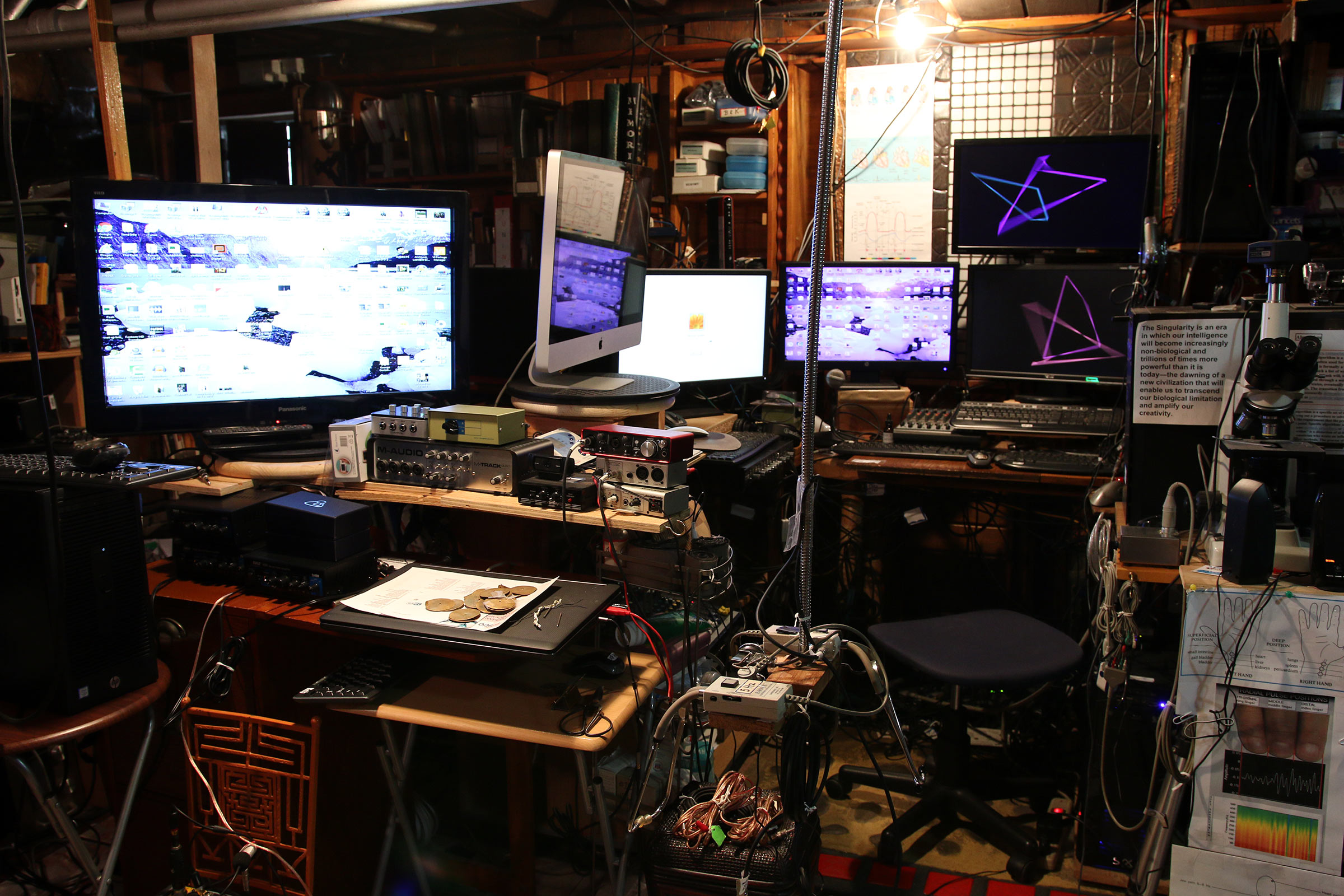 Various computer monitors in Milford Graves's studio.