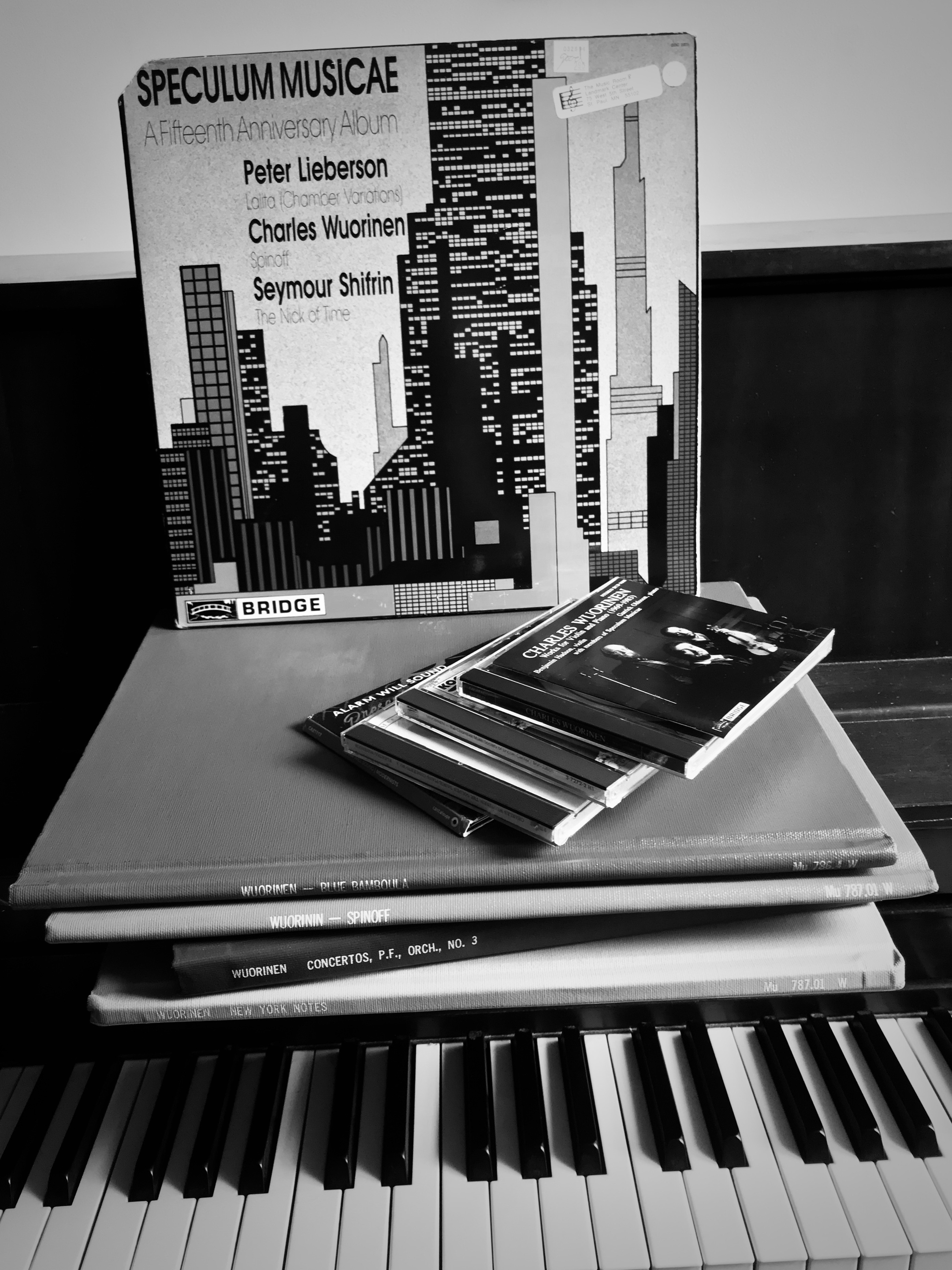 A collection of Wuorinen LPs and CDs on top of a digital keyboard.