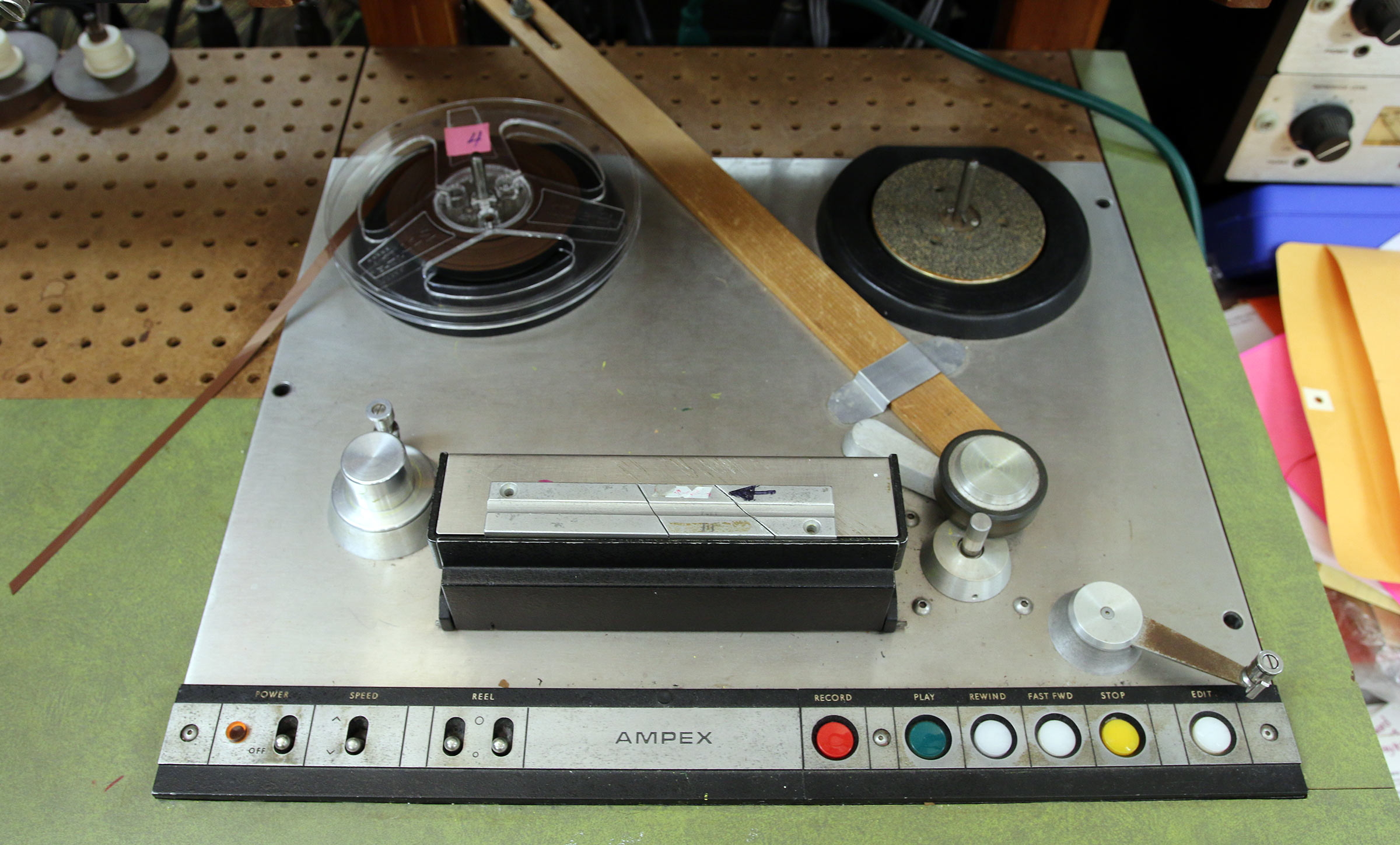 Daria Semegen still manipulates sound using reel-to-reel tapes and teaches her students to do so as well. And, after more than a half century of experience, she has well-tested preferences for what the best angles are for splicing. This is why there is a slab of wood positioned on this reel-to-reel machine (one of four at her Electronic Music Studio at Stony Brook University) which enables people working with the tape deck to precisely eyeball where to position a razor blade in order to make a splice on the tape.