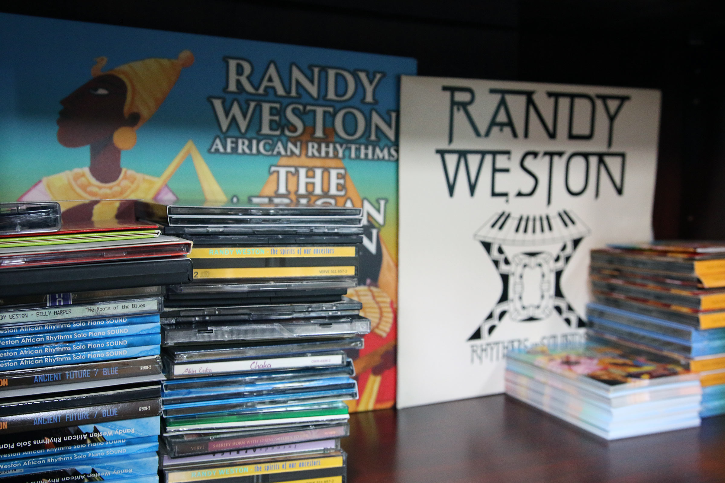 Some LPs of Randy Weston's music as well as piles of his CDs.