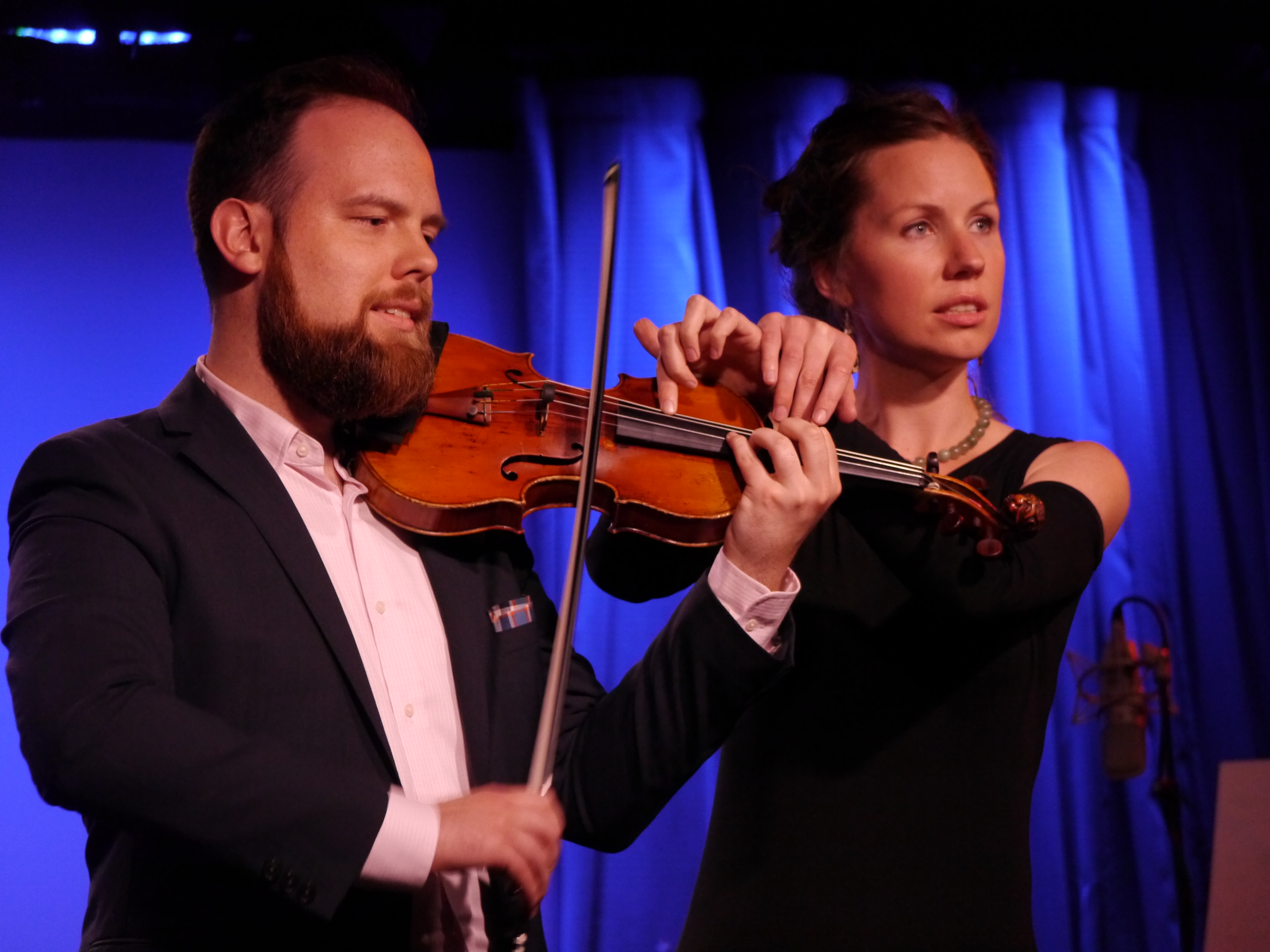 Kate Soper and Josh Modney performing on a violin with four-hands 