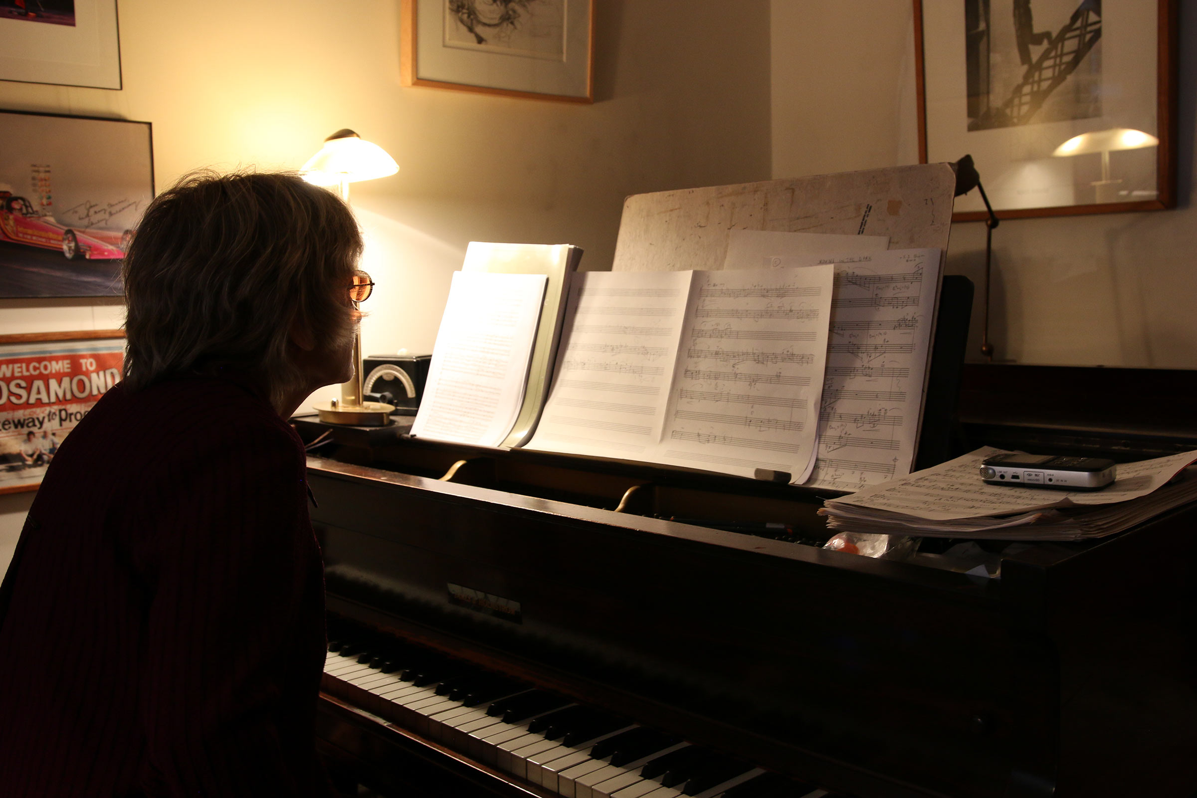 Jane Ira Bloom sitting in front of her grand piano.