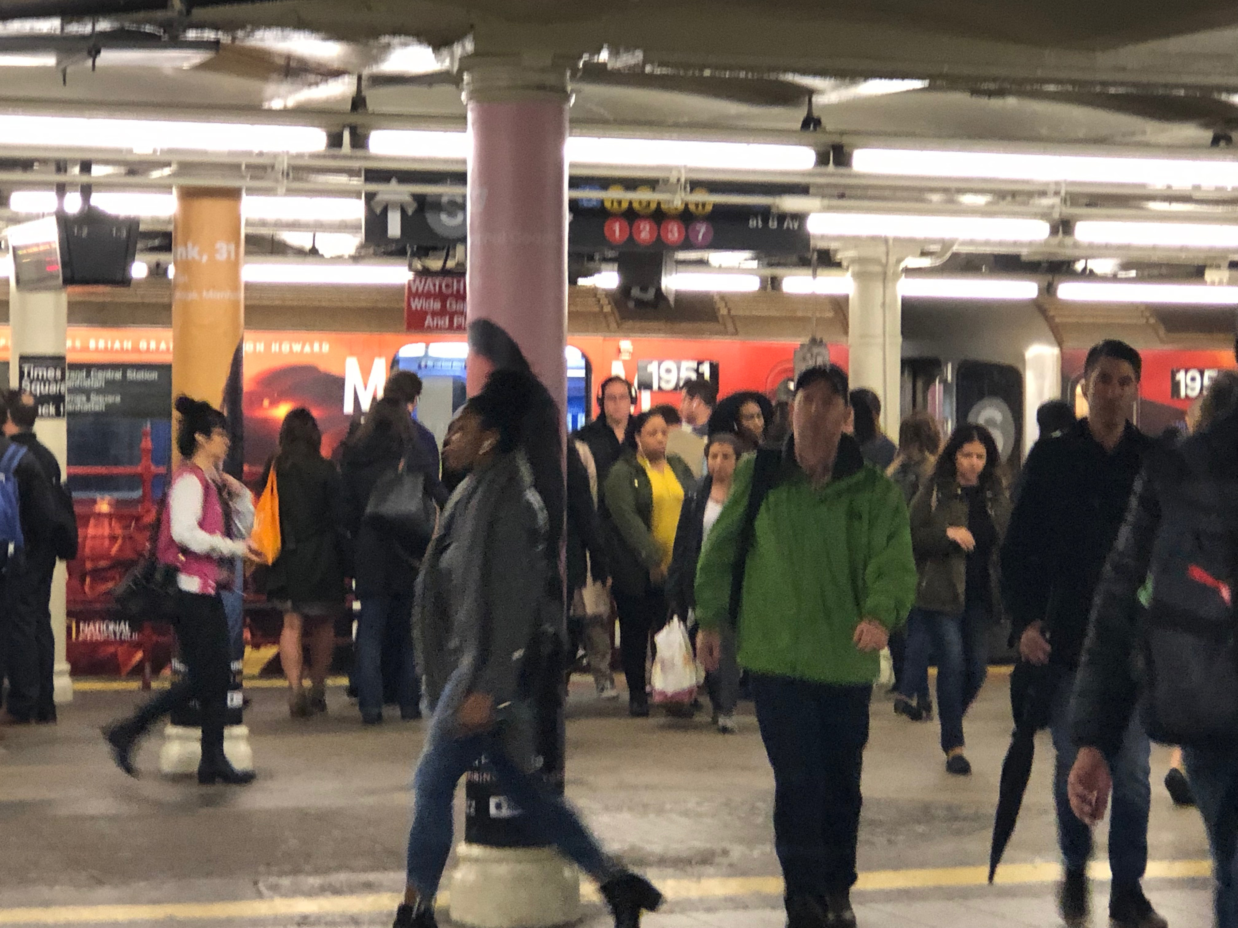 Commuters awaiting the shuttle train at Times Square