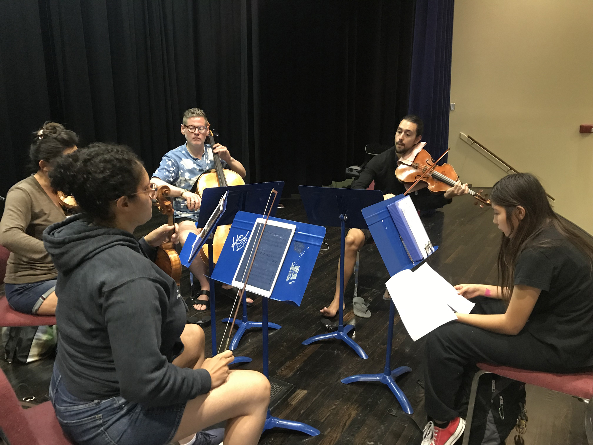 The Catalyst Quartet reads through a work in front of its composer at Hopi High in 2019.