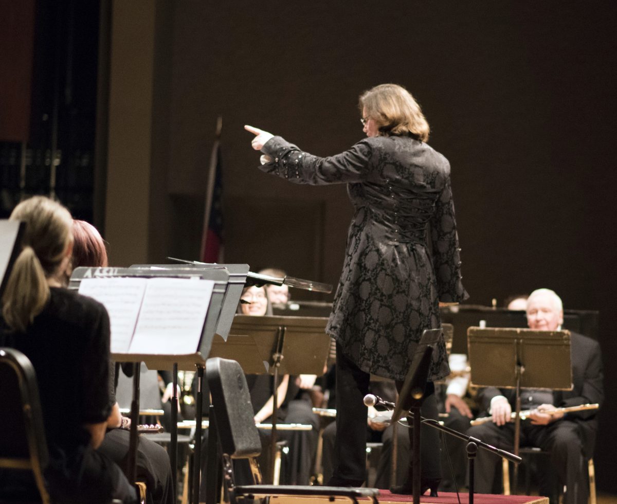 Julie Giroux conducting a wind band in 2018.